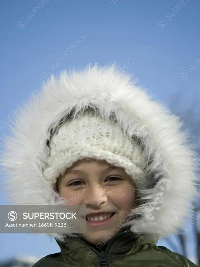 Portrait of a girl wearing a fur hat