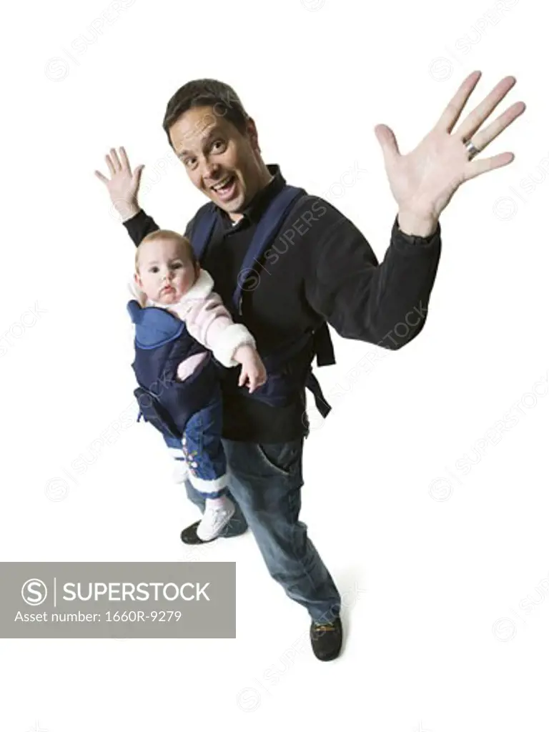 High angle view of a mature man carrying his daughter
