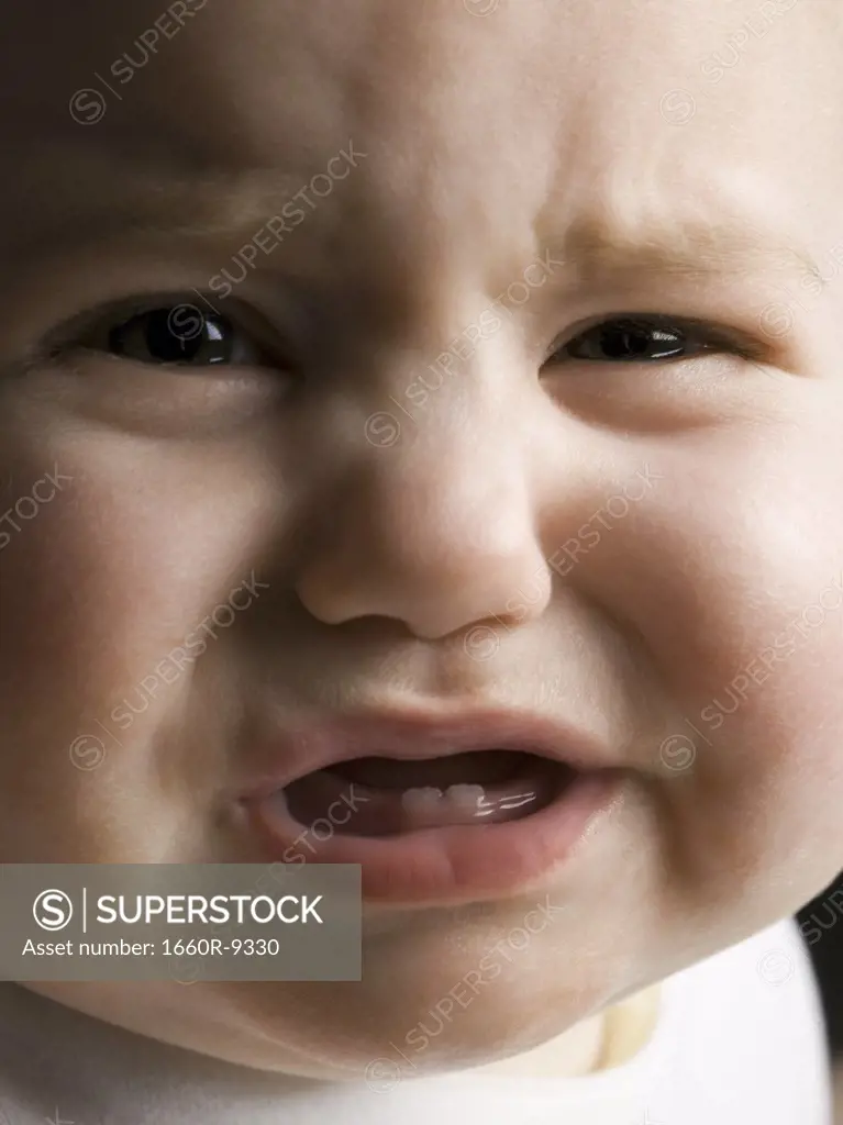 Close-up of a baby girl crying