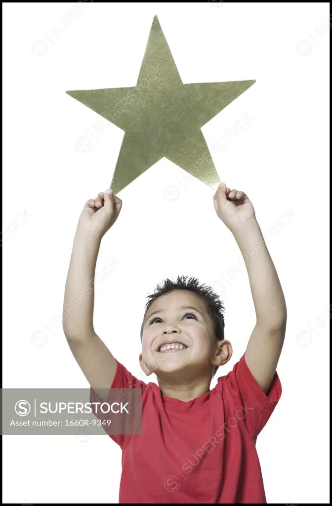 Close-up of a boy holding a star