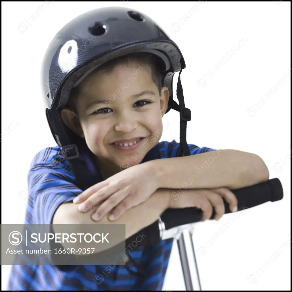 Portrait of a boy on a push scooter