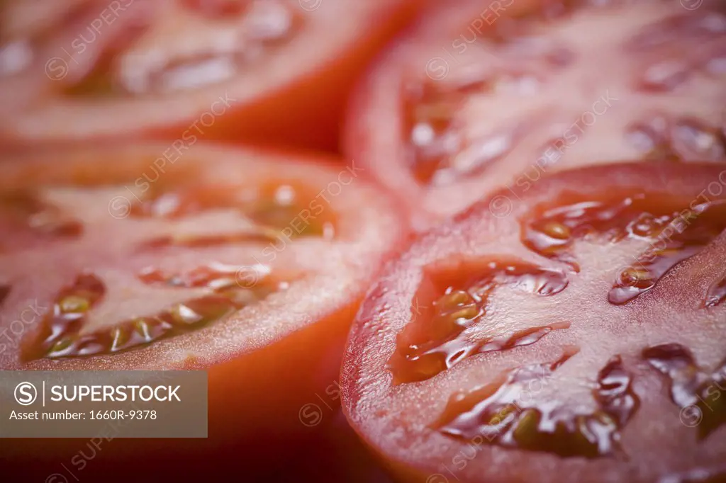 Close-up of four slices of tomato