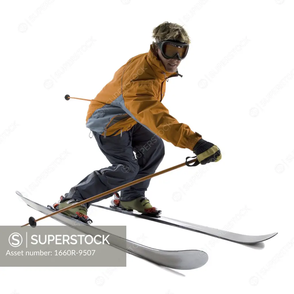 Profile of a young man skiing