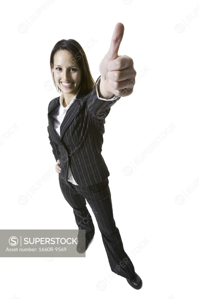 Portrait of a businesswoman showing a thumbs up sign