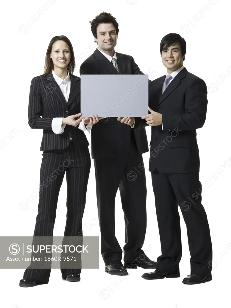 Portrait of two businessmen and a businesswoman holding a blank sign