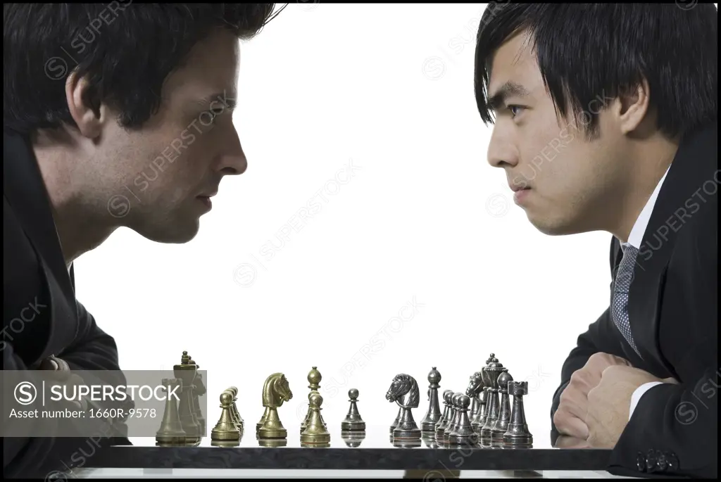 Close-up of two businessmen playing chess