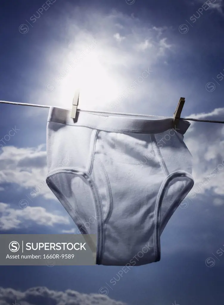 Close-up of a mens underwear hanging on a clothesline - SuperStock