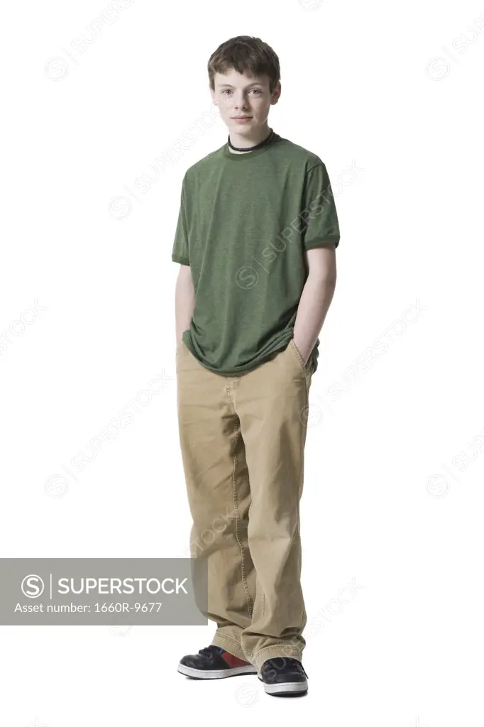 Portrait of a teenage boy standing with his hands in his pockets