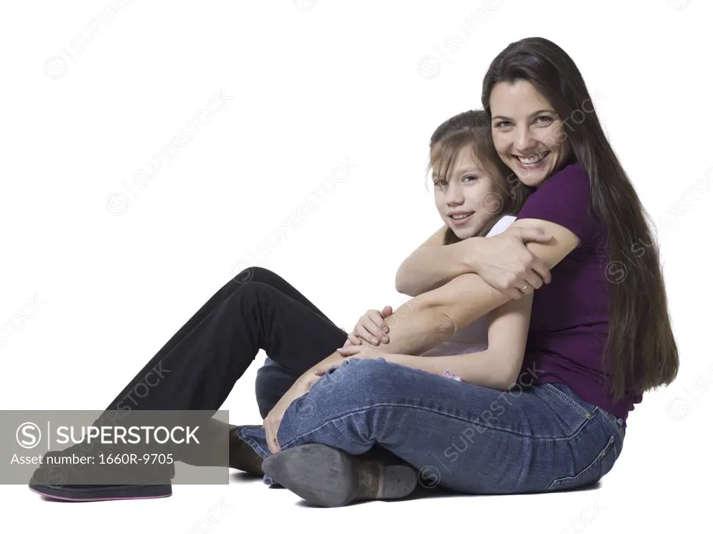 Portrait of a woman hugging her daughter