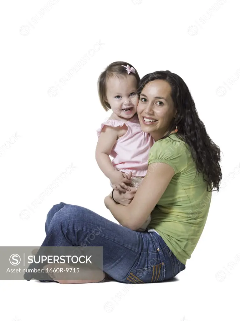 Portrait of a woman hugging her daughter