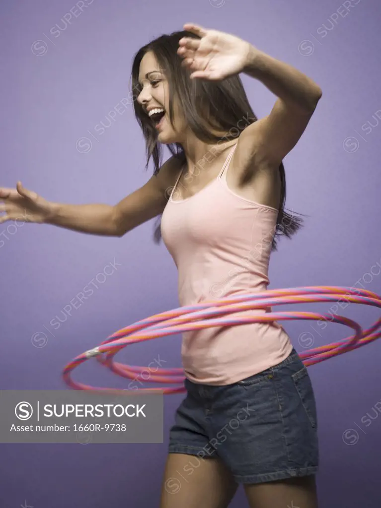Profile of a woman with hula hoops