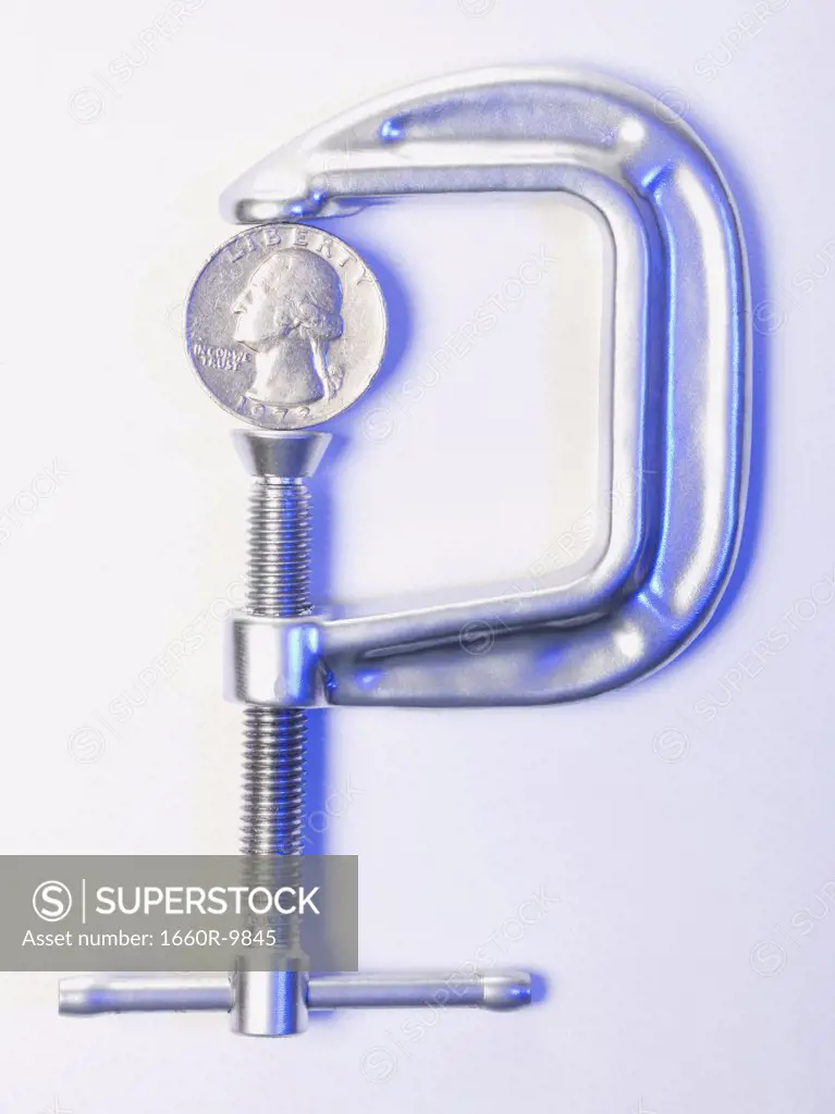 Close-up of a coin in a clamp