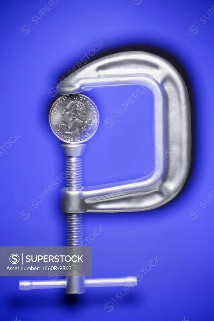 Close-up of a coin in a clamp