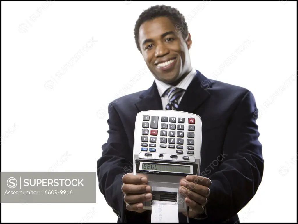 Portrait of a businessman holding an adding machine with the numeric text "SELL"