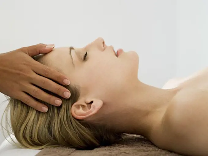 Woman getting head massage
