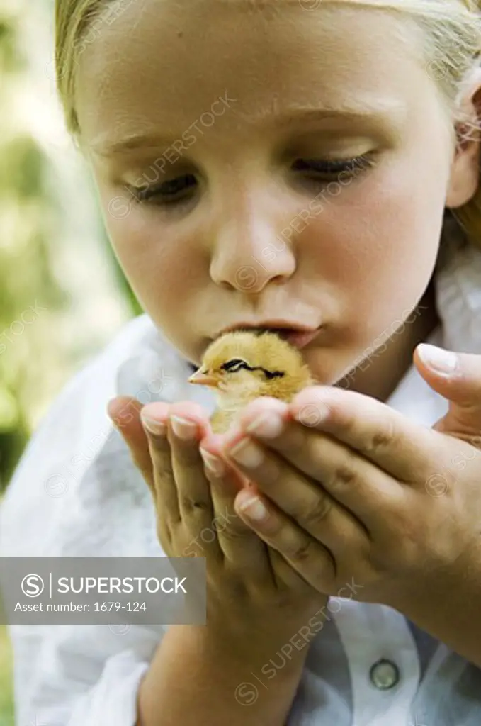 Close-up of a girl kissing a chick