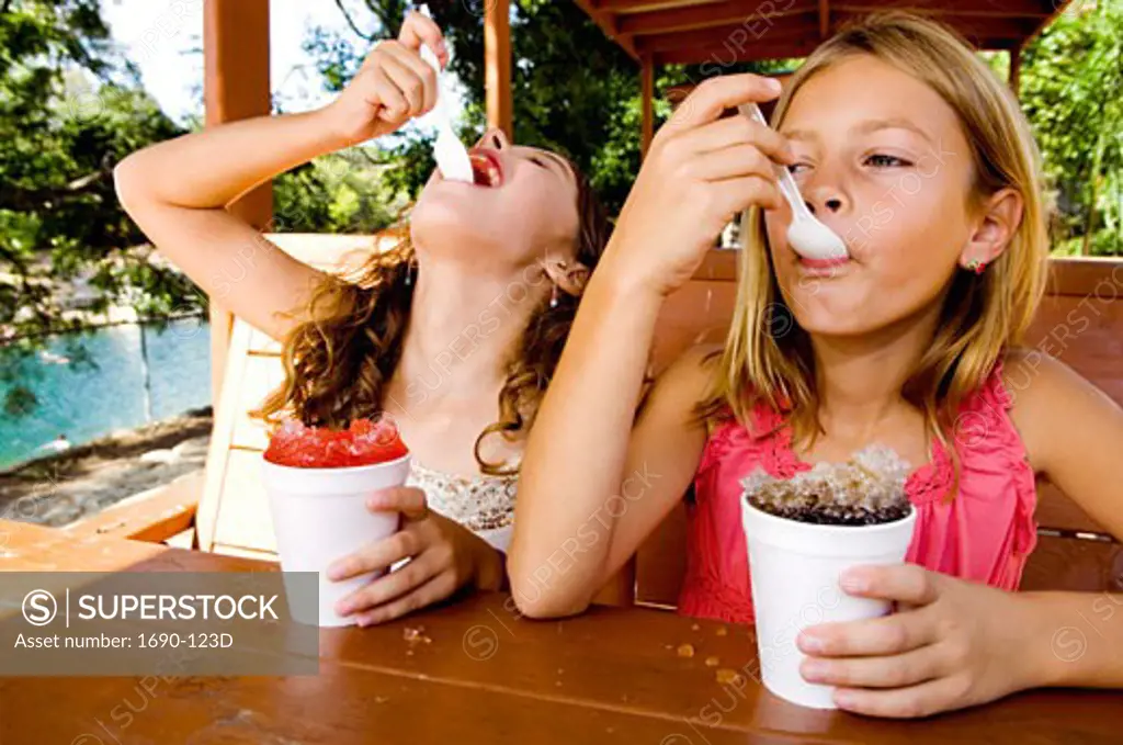 Two girls eating shaved ice