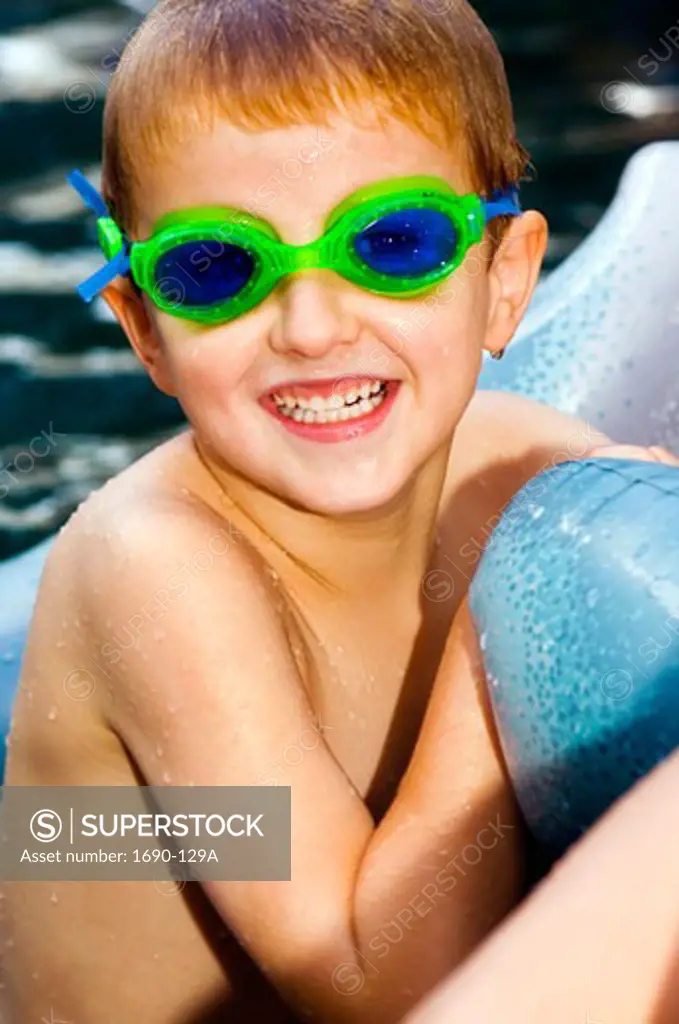 Close-up of a boy weaing swimming goggles