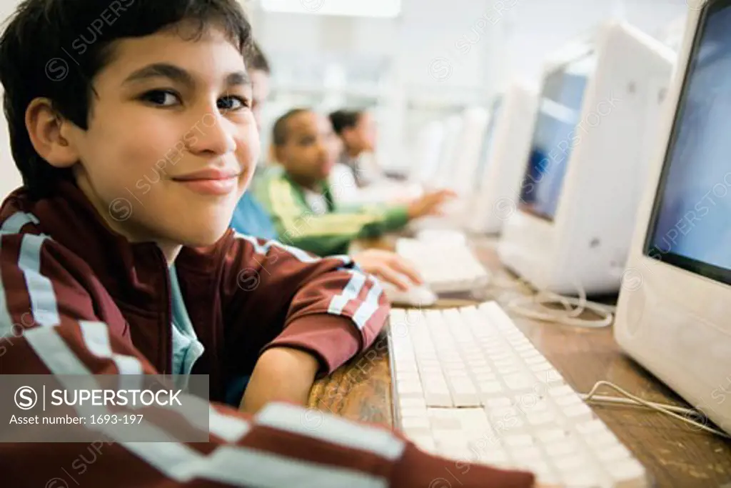 Portrait of a boy using a computer