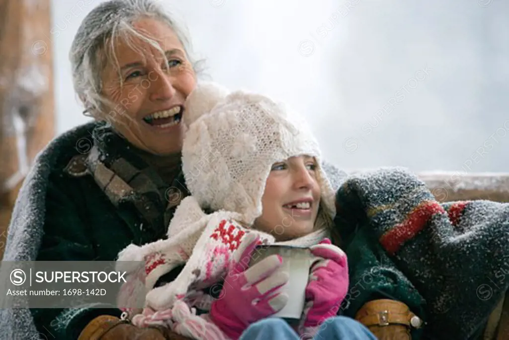 Senior woman with her granddaughter smiling