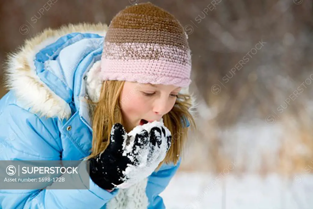Girl eating snow