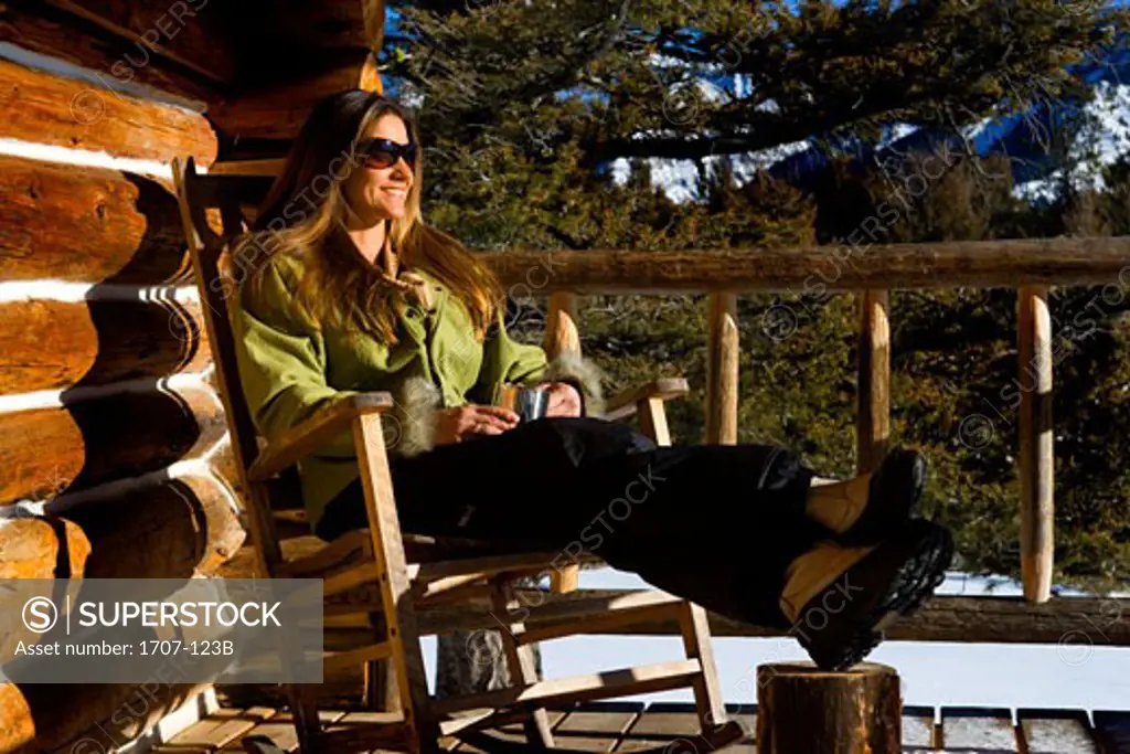 Mid adult woman sitting in a rocking chair