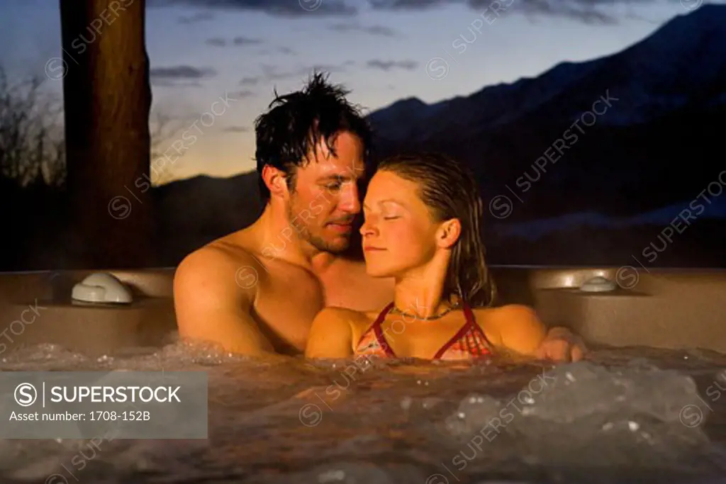 Mid adult couple in a hot tub