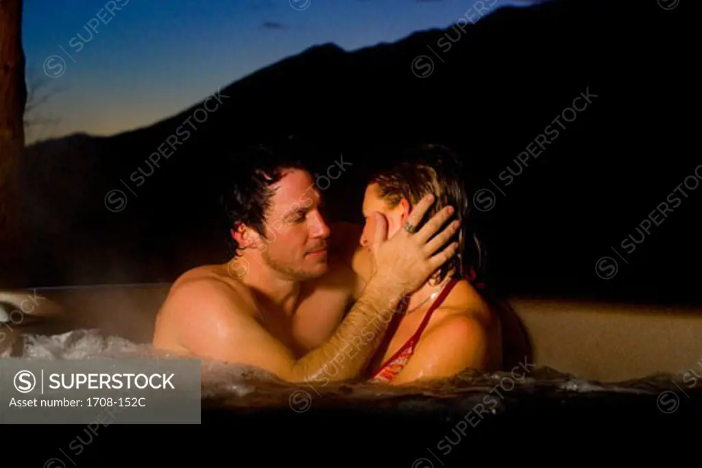 Mid adult couple in a hot tub