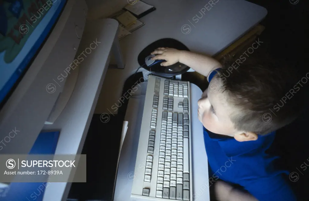 High angle view of a boy using a computer