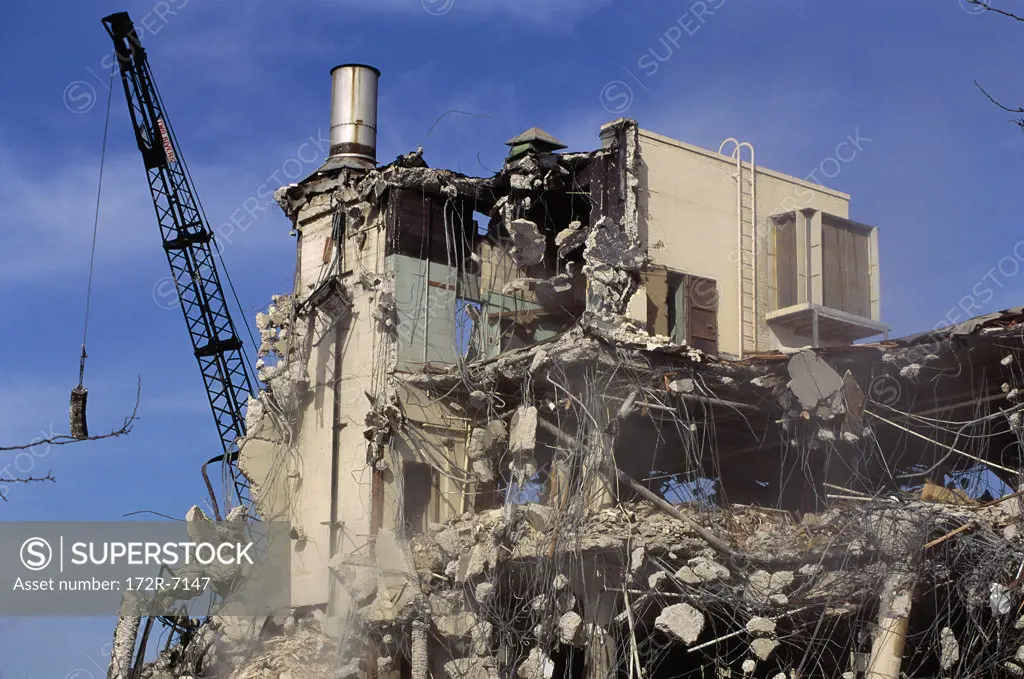 Wrecking ball and a demolished building