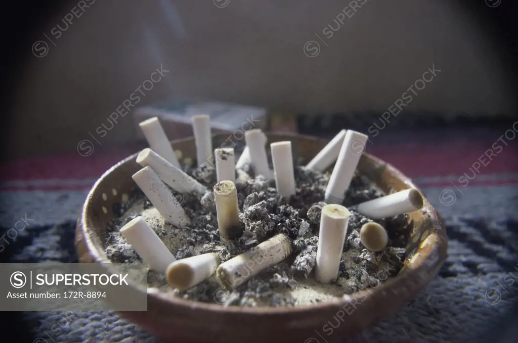 Close-up of cigarette butts in an ashtray