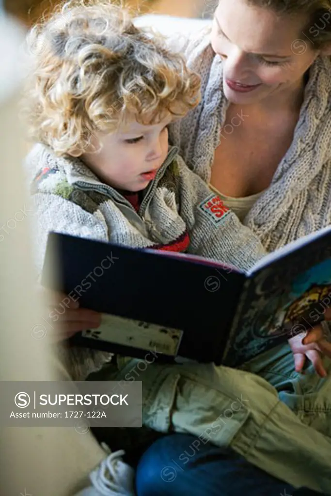 Mid adult woman reading with her son