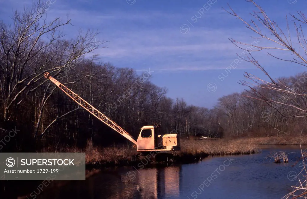 Abandoned crane in a forest