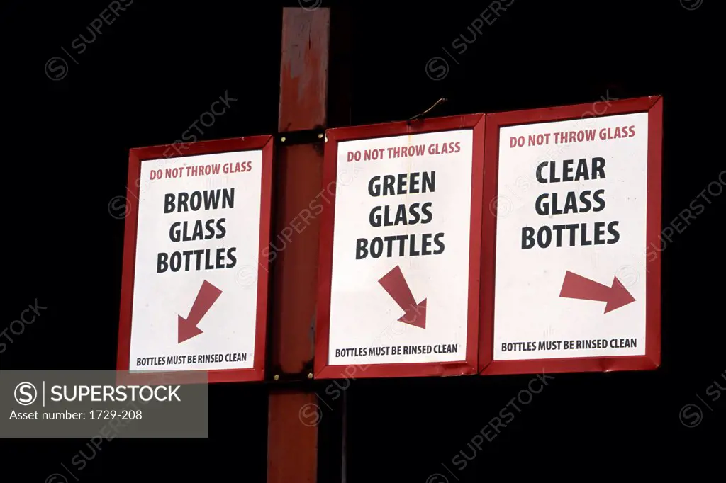 Recycling symbol signboard at a glass recycling area