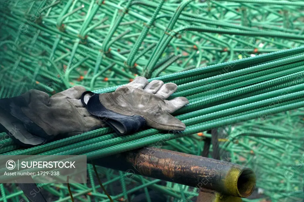Work gloves and steel rods at a construction site, New York City, New York State, USA