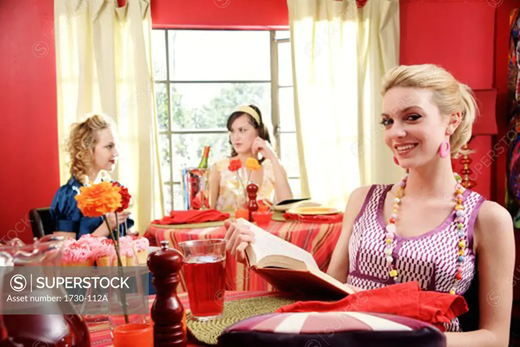 Three young woman dining in a restaurant