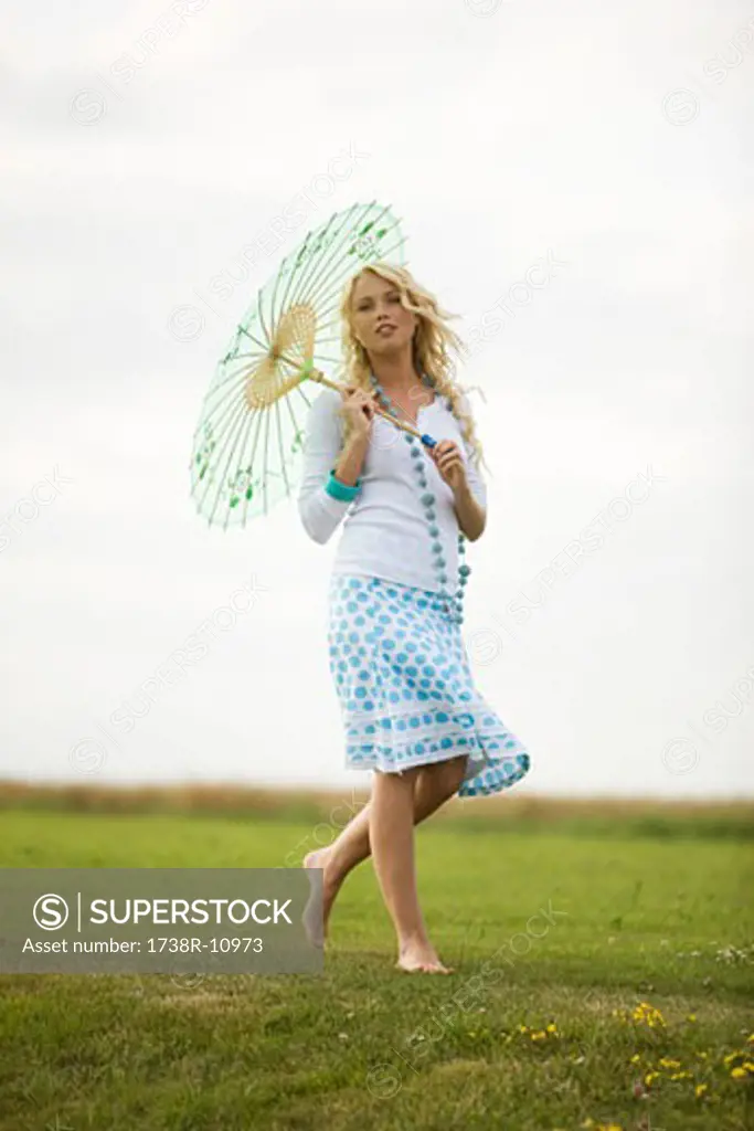 Young woman holding an umbrella