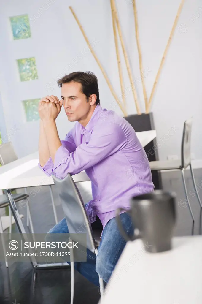 Man sitting on a chair and thinking
