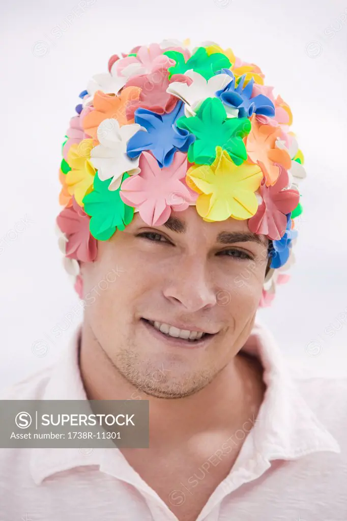 Portrait of a man wearing a flower cap