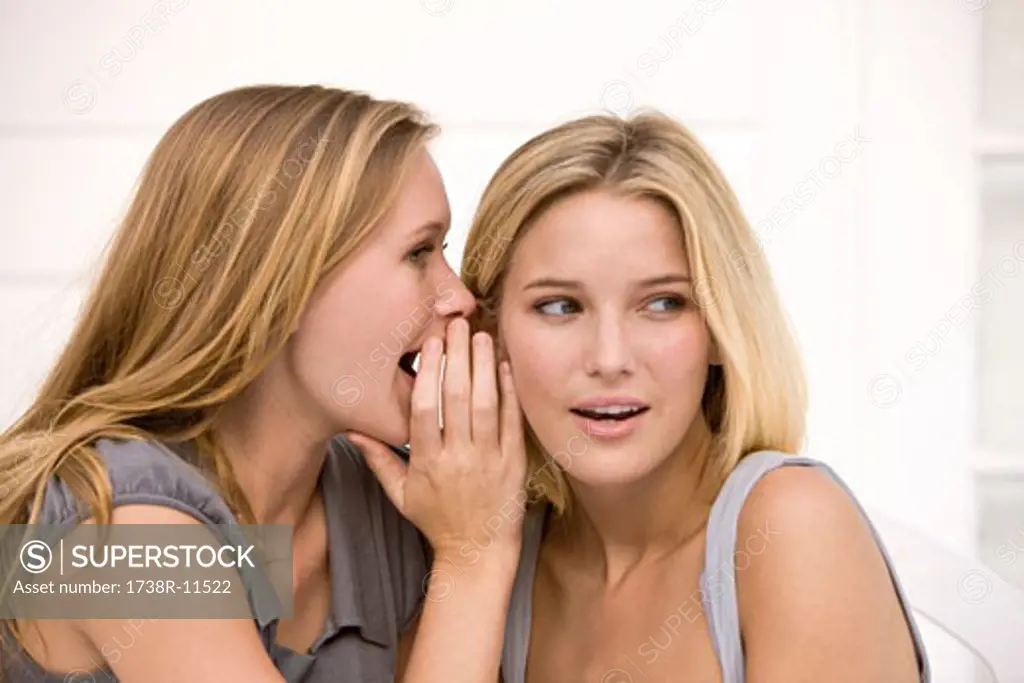 Close-up of two women gossiping