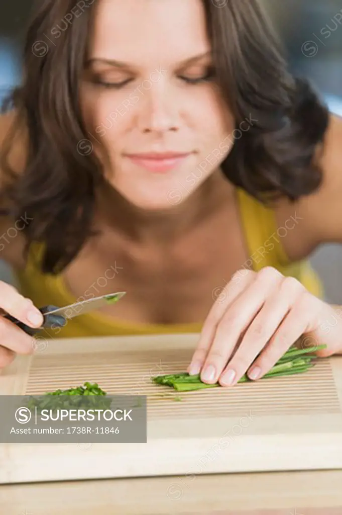 Woman chopping chives