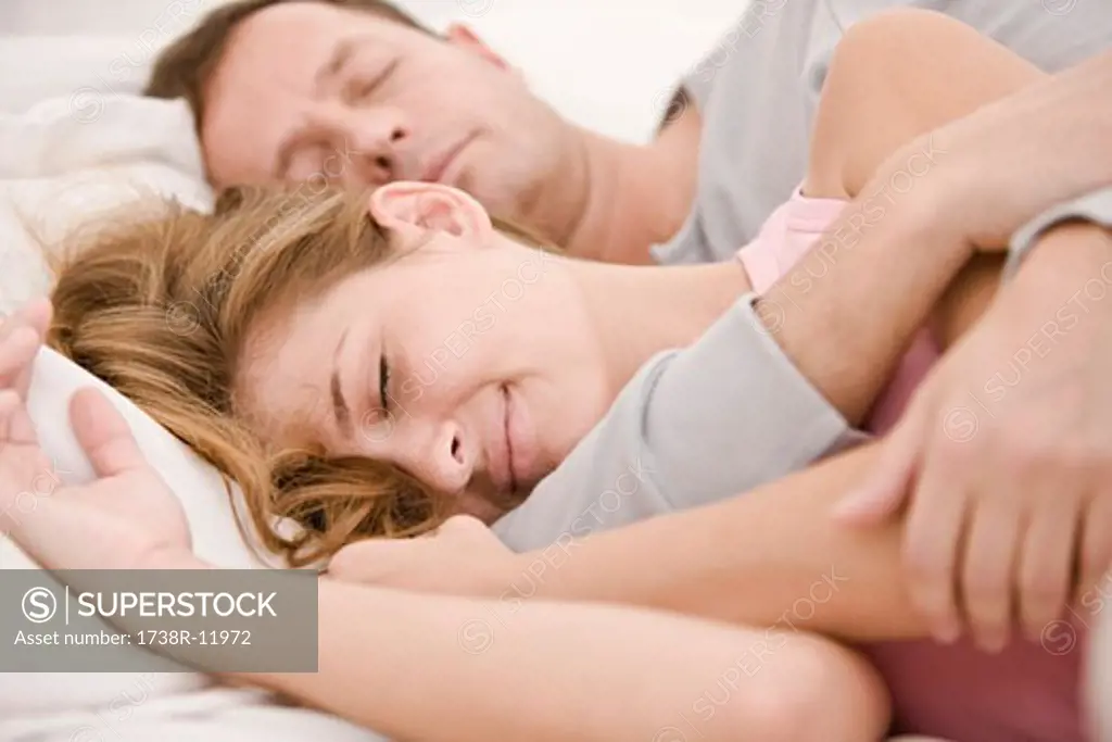Couple sleeping on the bed