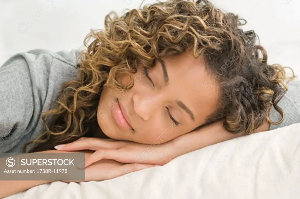 Close-up of a girl sleeping on the bed