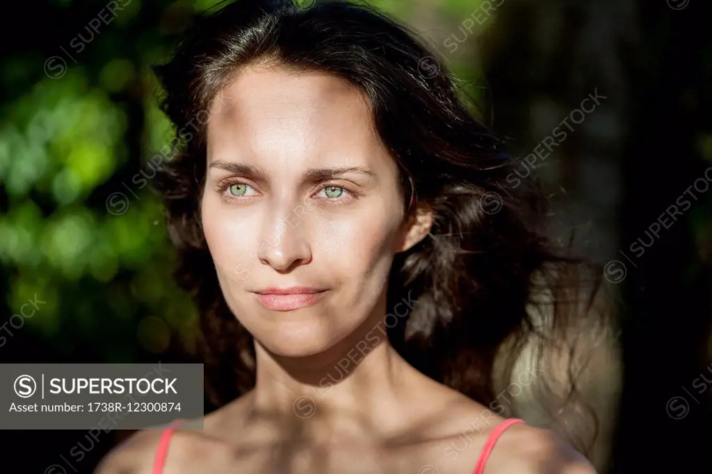 Close-up of a beautiful woman thinking