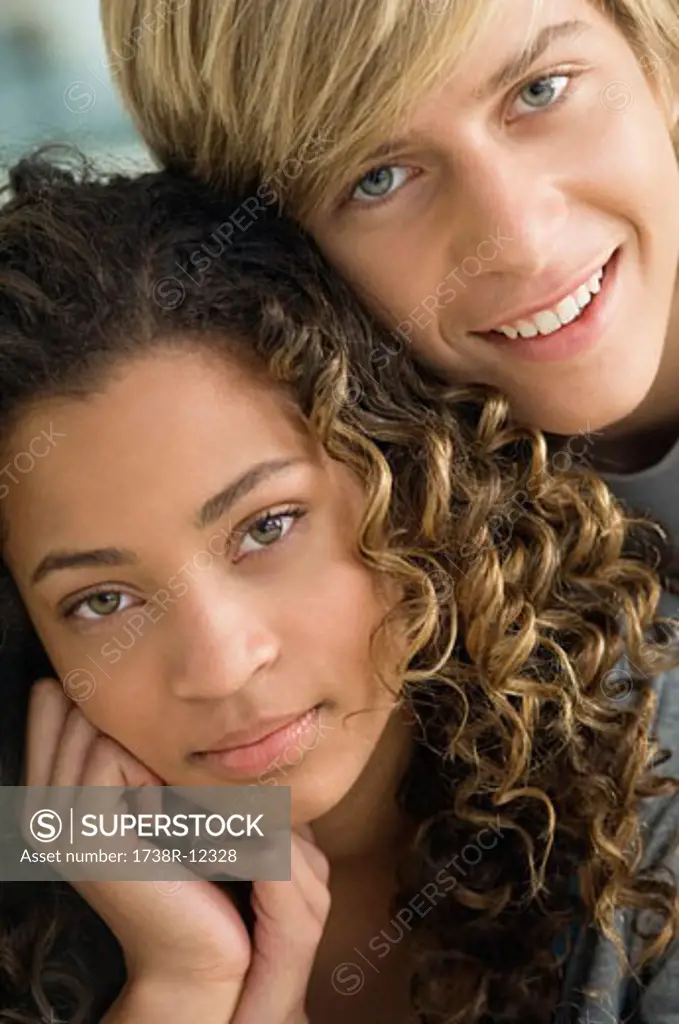 Teenage boy smiling with a girl