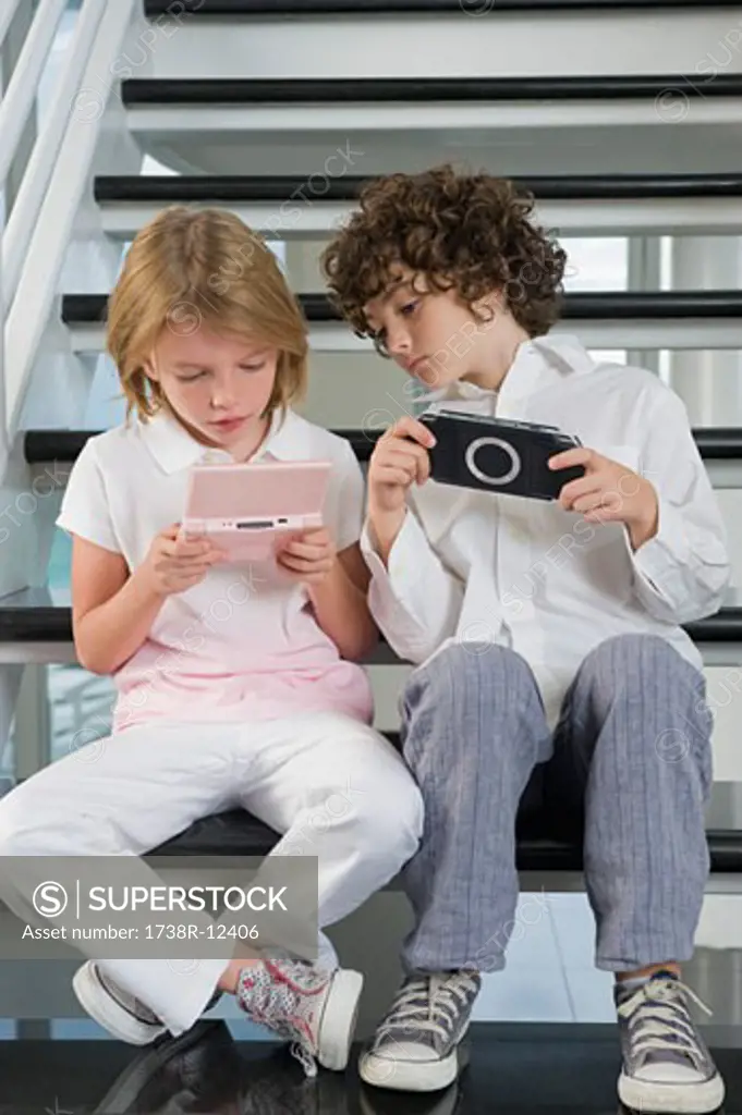 Boy and a girl playing video game