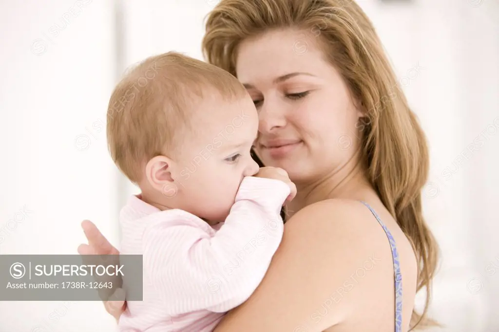 Woman holding her daughter