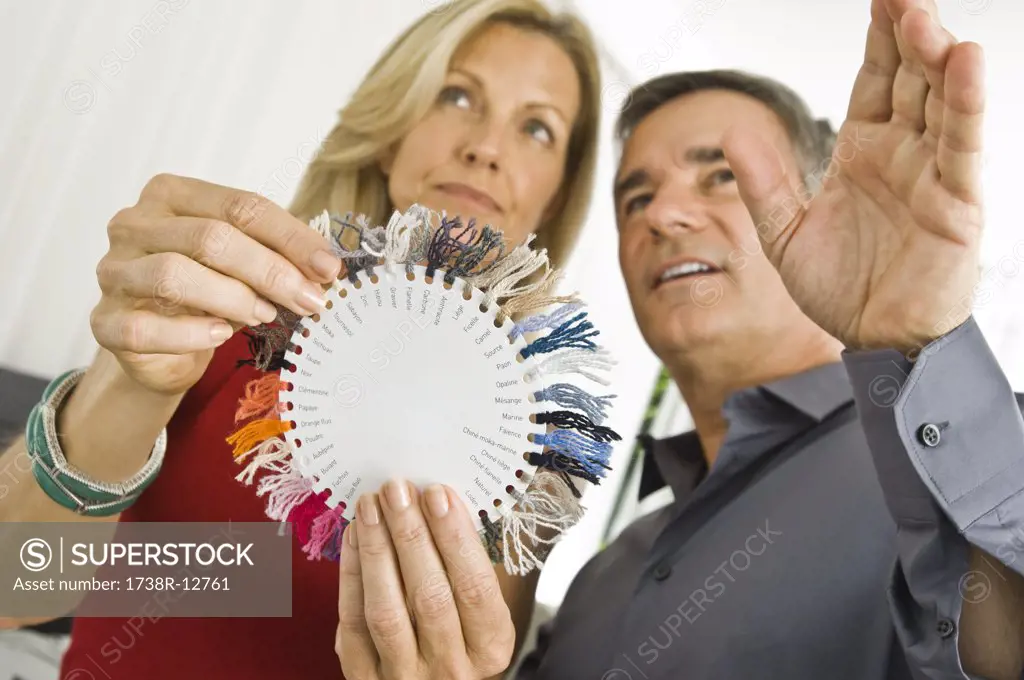 Couple choosing color from a color swatch