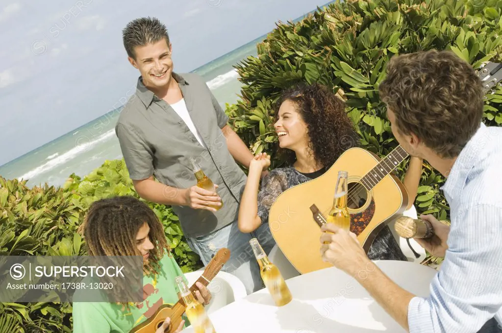 Friends enjoying beer and music on vacations