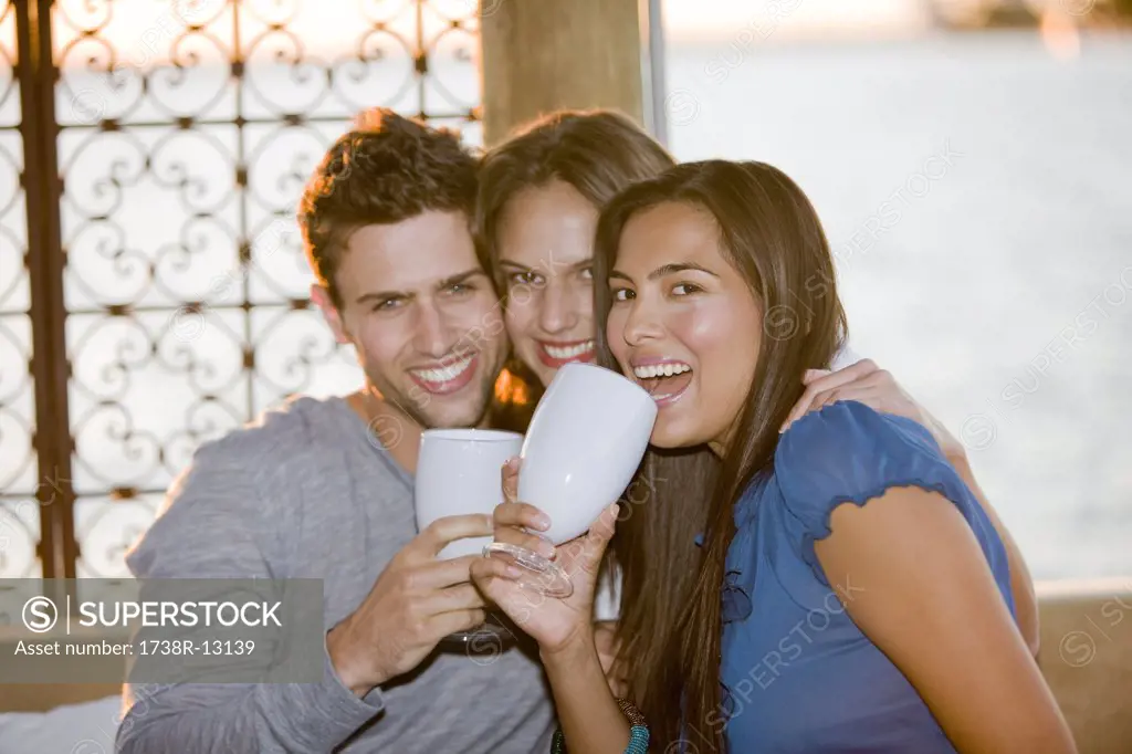 Three friends enjoying drinks